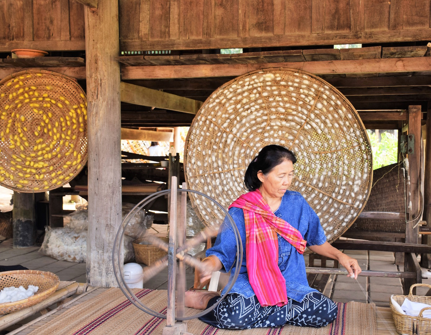 Local artisans in a silk weaving workshop.